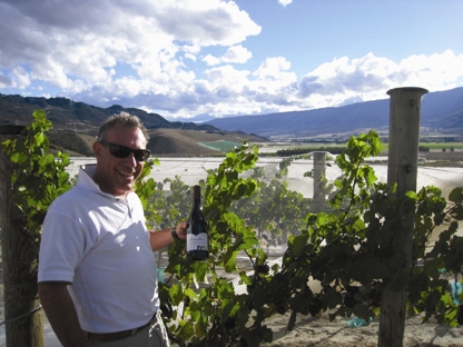 Domenic in the vineyard with a bottle of the Mondillo 2008 Pinot Noir